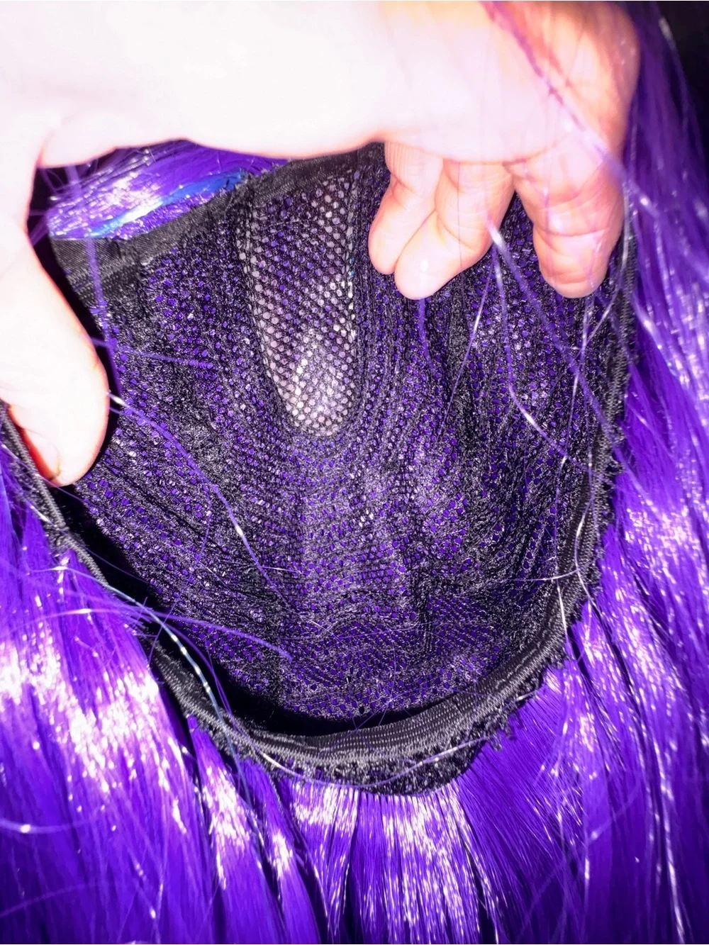 Purple synthetic long wig with blue highlights